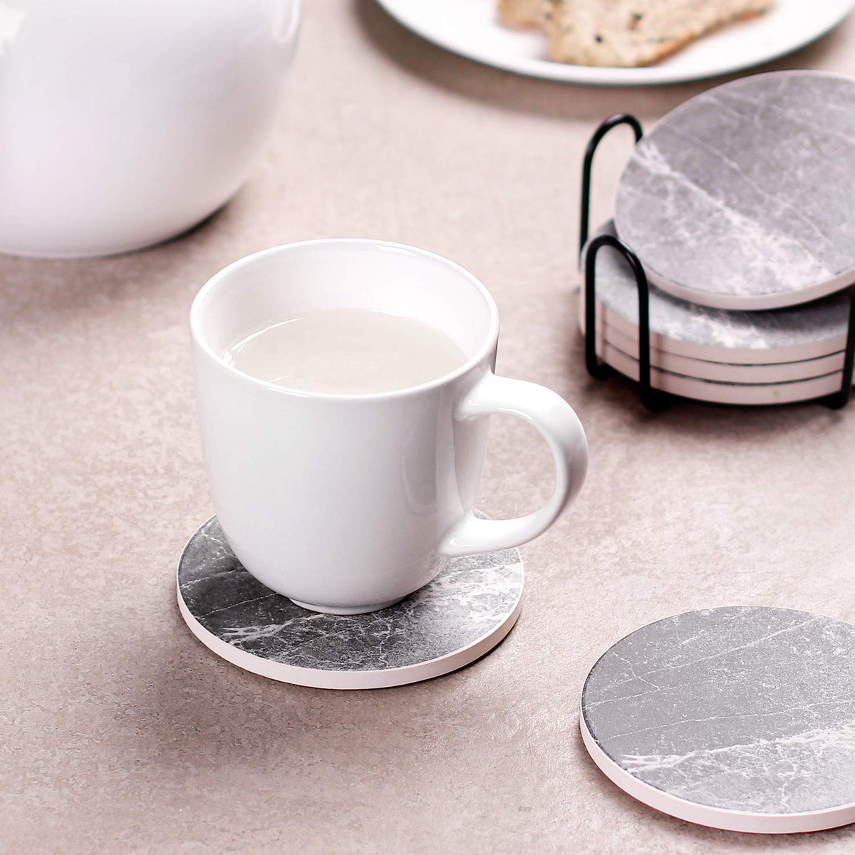 LIFVER coasters protect wooden and marble surfaces from moisture and scratches.