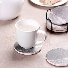 LIFVER coasters protect wooden and marble surfaces from moisture and scratches.