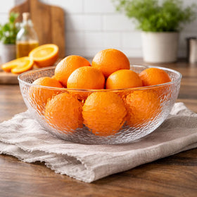 Close-up of textured surface on Lillian Collection hammered bowl for refined table presentation.