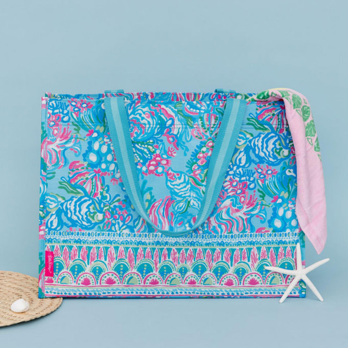 Lilly Pulitzer Aqua La Vista market tote folded flat demonstrates compact storage option.
