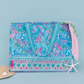 Lilly Pulitzer Aqua La Vista market tote folded flat demonstrates compact storage option.