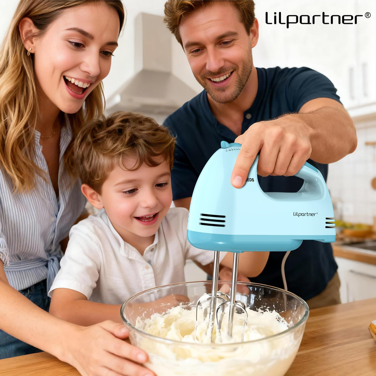 LILPARTNER Beaters blending batter to a uniform texture.