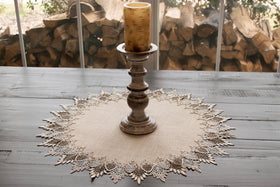 Linens Art and Things lace doily on table demonstrating versatile round topper.