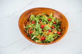 Versatile serving bowl for fruit, salads, or decorative displays.