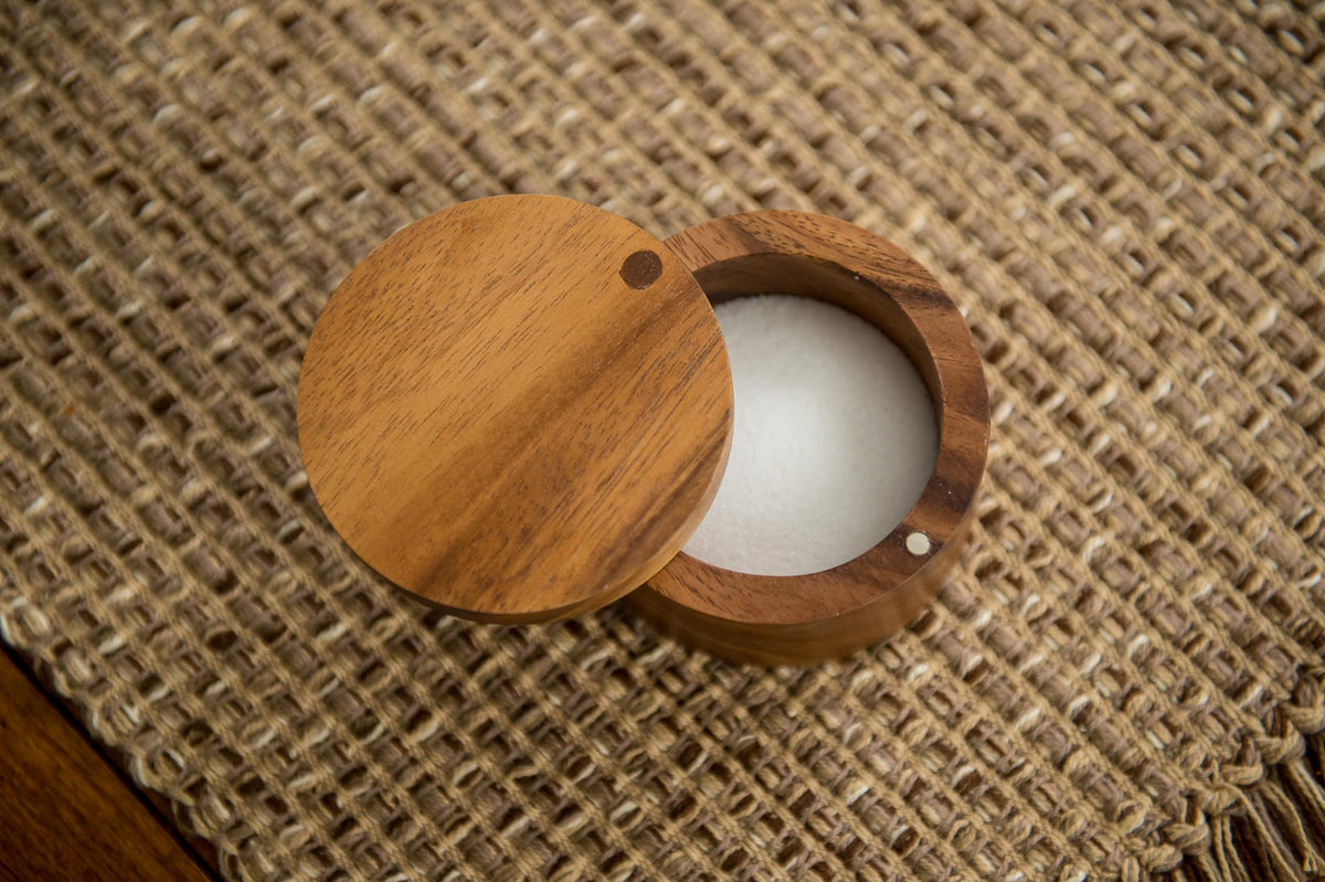 Lipper International acacia salt box at the dining table complements decor.