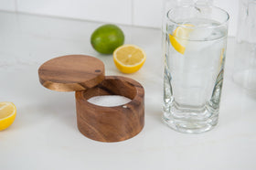 Lipper International acacia salt box filled with spices for table seasoning.