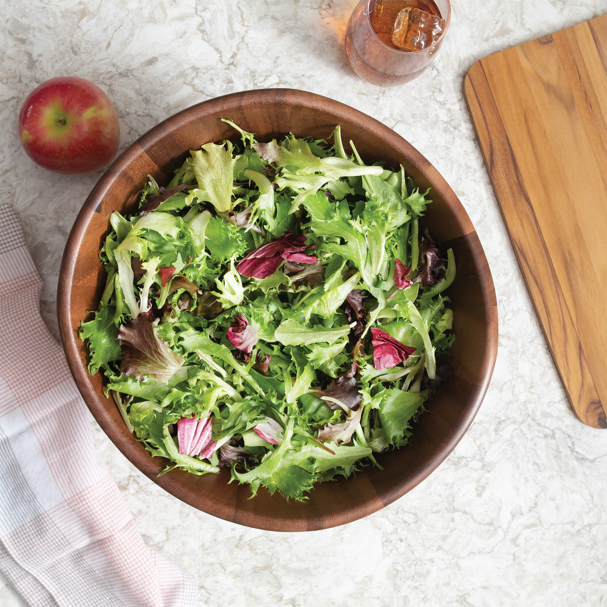 Lipper International acacia wave bowl filled with fruit shows versatility for kitchen and table