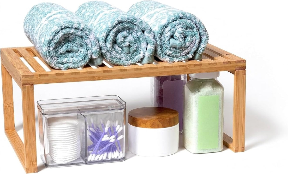 Lipper international Bamboo Shelf enhances bathroom organization for towels and toiletries.