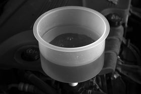 Lisle spill-free funnel in use helps prevent messy spills