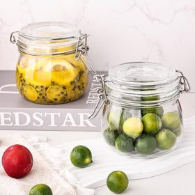 Clear wide-mouth glass jar for easy filling of pasta, beans, or sugar.