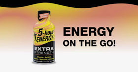 Living Essentials 5-hour Energy shot bottle on a desk for a quick focus boost.