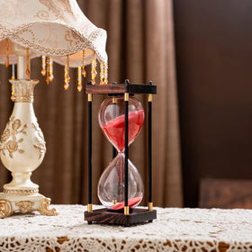 Lmzxmcy closeup sand-flow hourglass showing steady timer action for focus sessions.