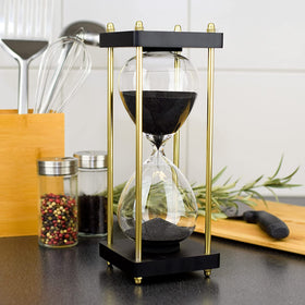 Lmzxmcy sand timer in office shelf, enhancing ambient work environment.