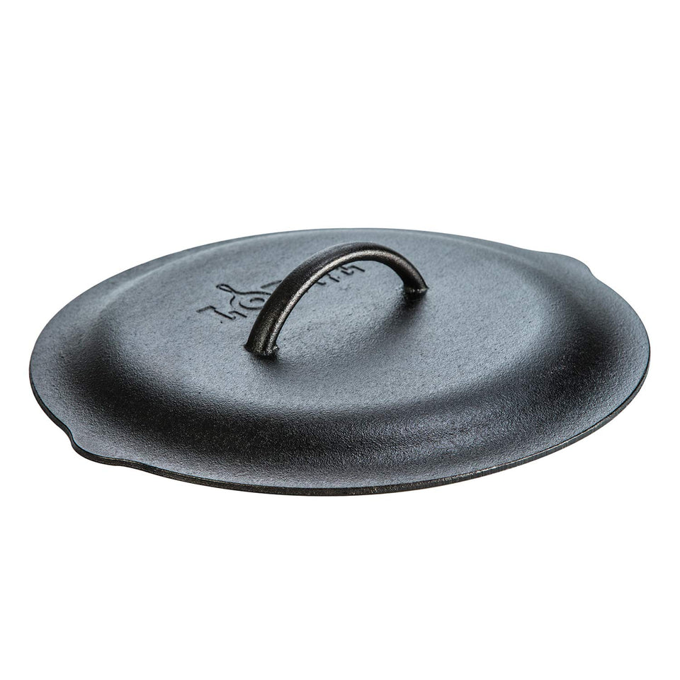 Lodge 12-inch cast iron lid with handle for secure lifting and heat retention.