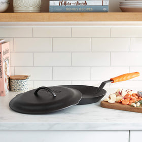 Lodge 12-inch cast iron lid interior with basting tips for even moisture distribution.