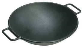 Lodge Bold 14-inch wok in-use on the stovetop for a sizzling stir-fry.