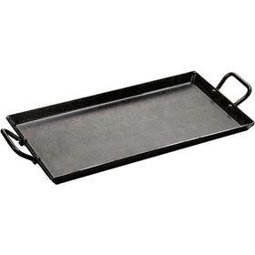 Lodge carbon steel griddle in oven for even heating and versatile cooking