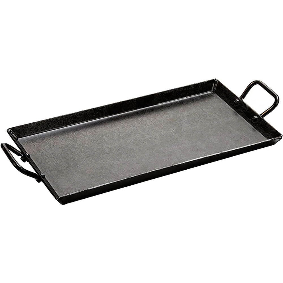 Lodge carbon steel griddle in oven for even heating and versatile cooking