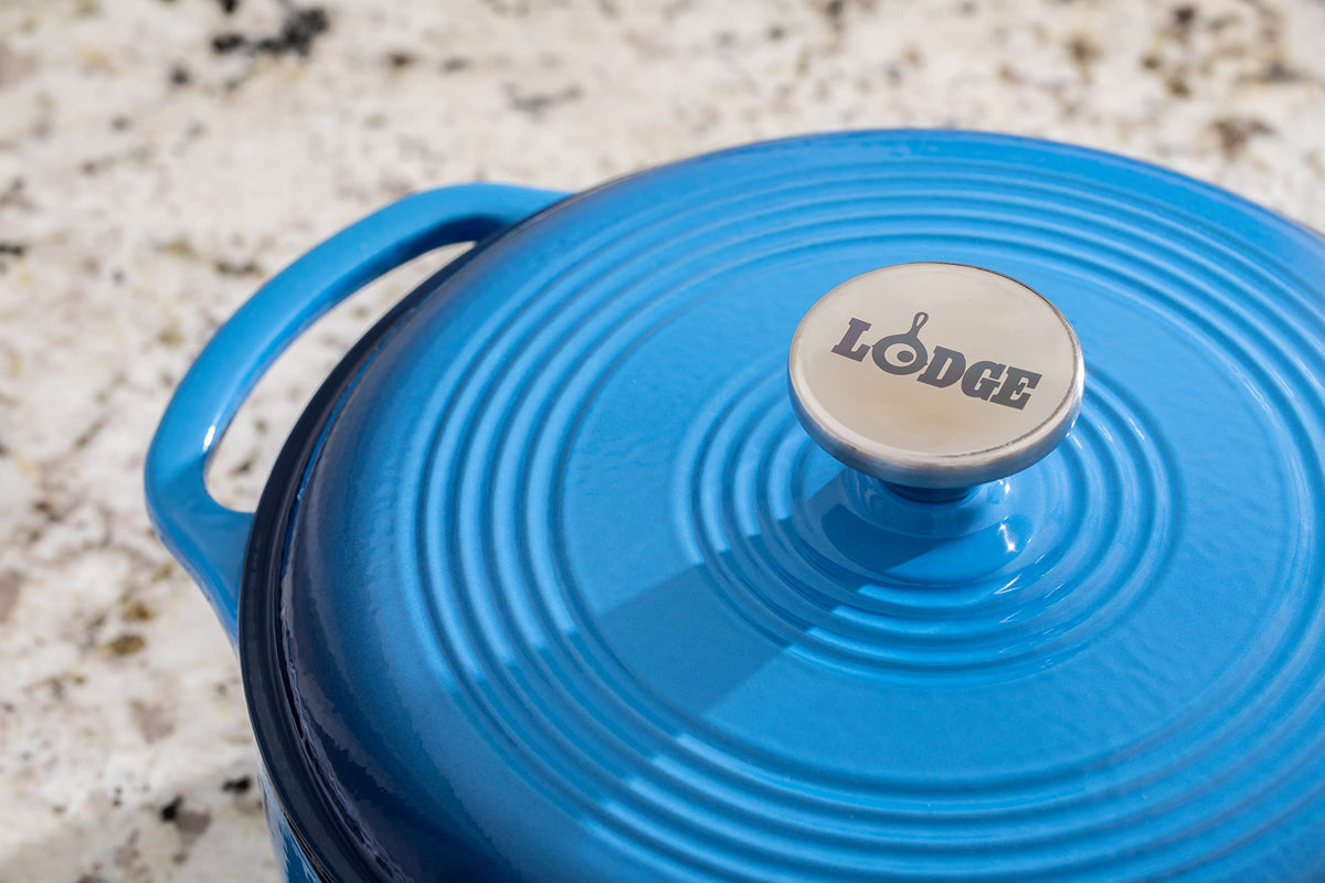 Lodge Caribbean Blue Dutch Oven cleaning close-up, simple handwashing care.