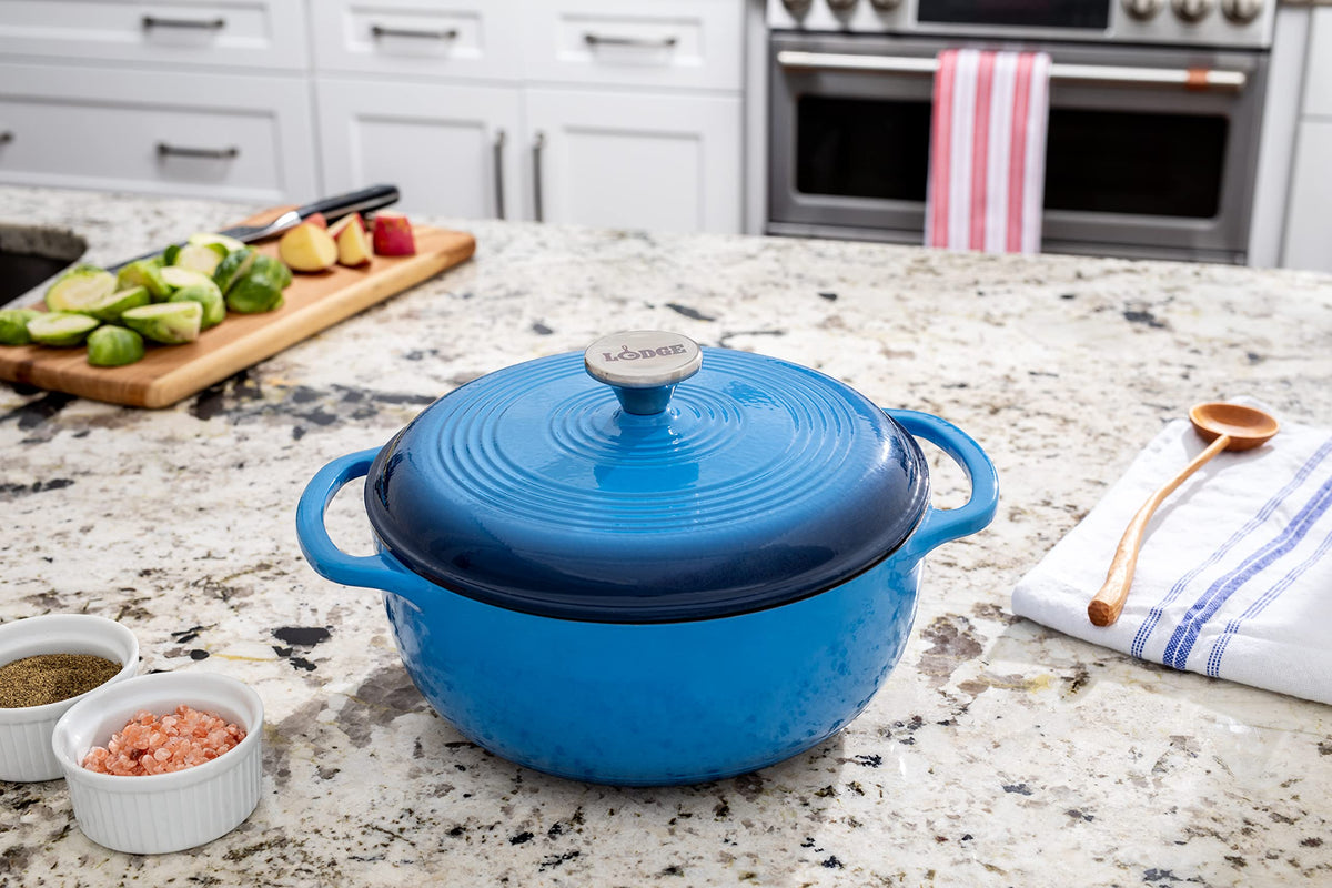 Lodge Caribbean Blue Dutch Oven served at table, ready to share a meal.