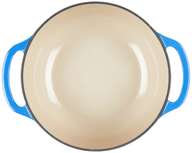 Lodge Caribbean Blue Dutch Oven on stovetop, versatile heating for meals.