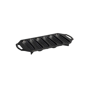 Lodge cast iron cornstick pan with six sticks for dunkable sides and rustic appeal.