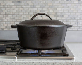 Flat-bottom Lodge cast iron Dutch oven sits stable on stovetops and in ovens.
