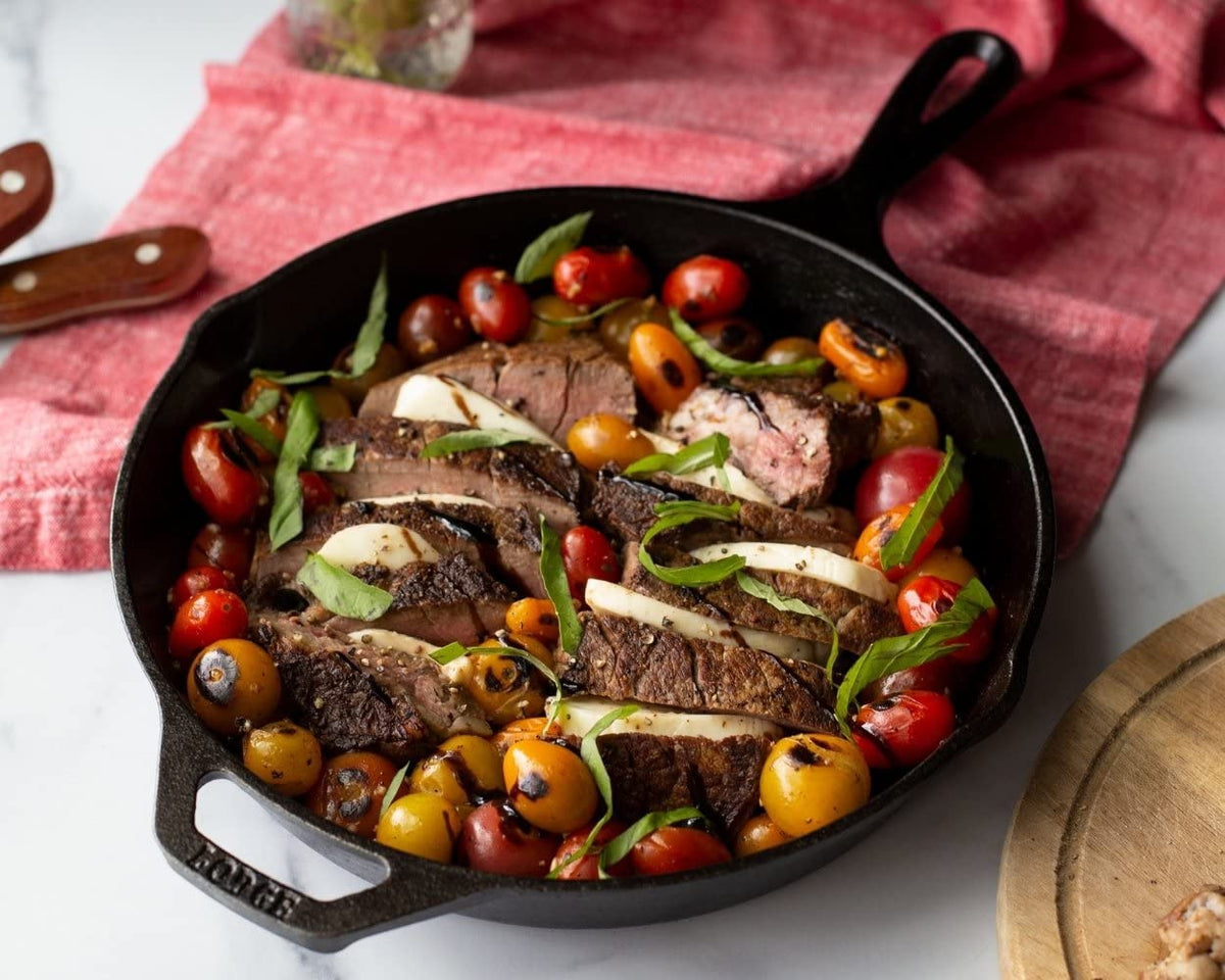 Lodge skillet with assist handle enables steady lifting and safe maneuvering.