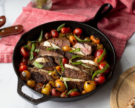 Lodge skillet with assist handle enables steady lifting and safe maneuvering.