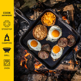 Lodge 11-inch square cast iron griddle, bacon sizzling for searing flavor.