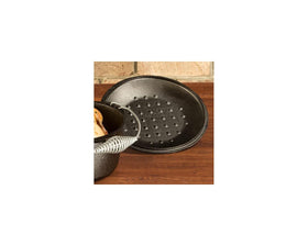 Lodge 10-1/4-inch lid fits compatible cookware for even basting.