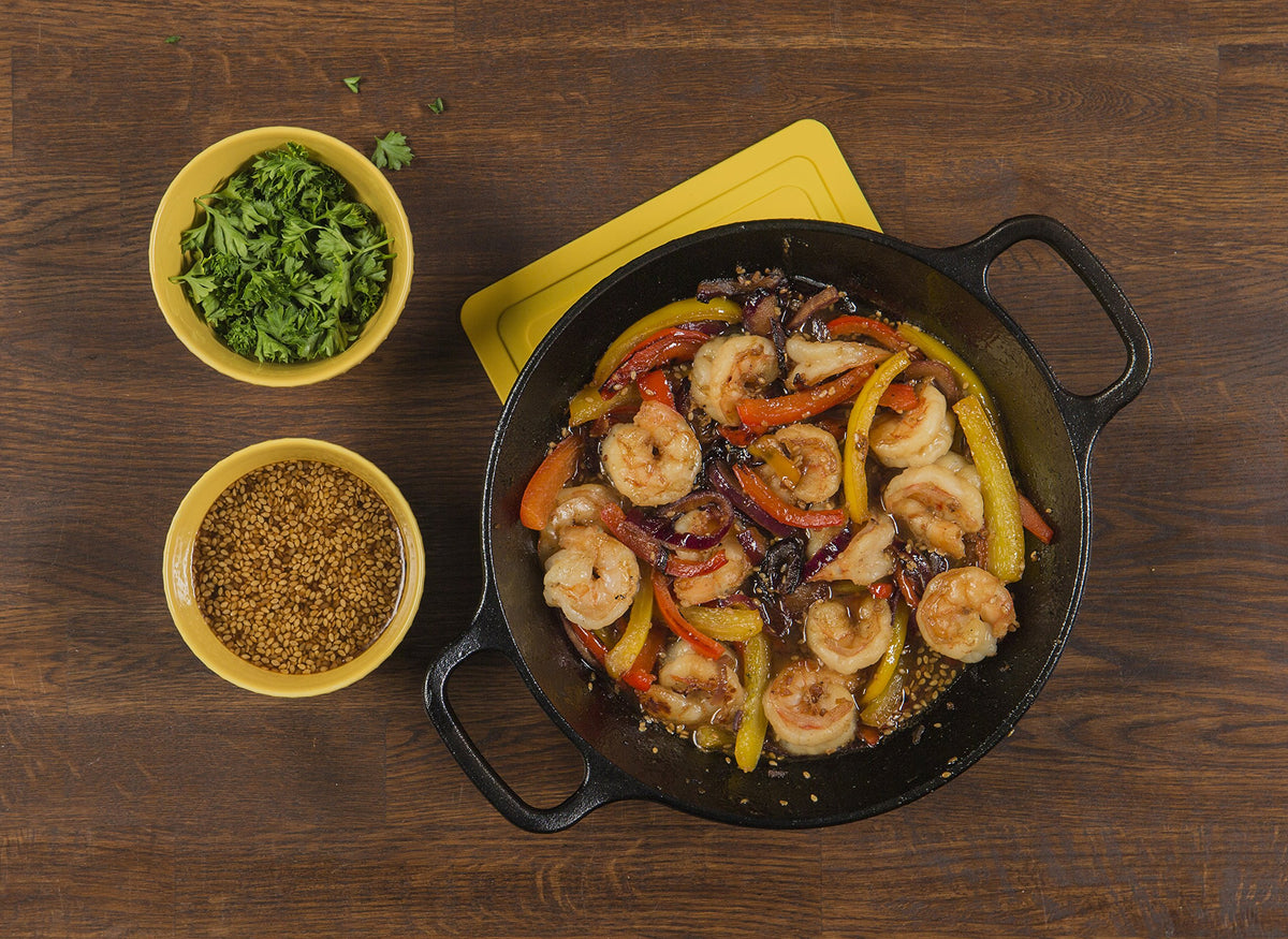 Lodge dual-handle cast iron skillet close-up emphasizes sturdy grip and even heating potential
