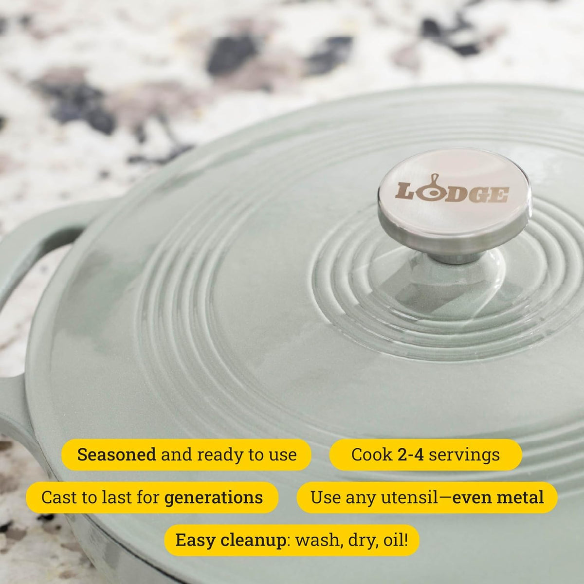 Lodge Essential Enamel Braiser with dual assist handles for secure transport.