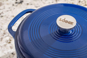 Lodge enamel pot with dual assist handles enables easy transfer from stove to table.
