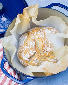 Lodge Dutch oven with moisture-locking lid demonstrates flavor sealing during slow cooking.