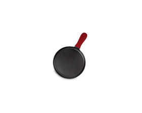 Lodge silicone handle holder attached to the cast iron griddle for heat protection.