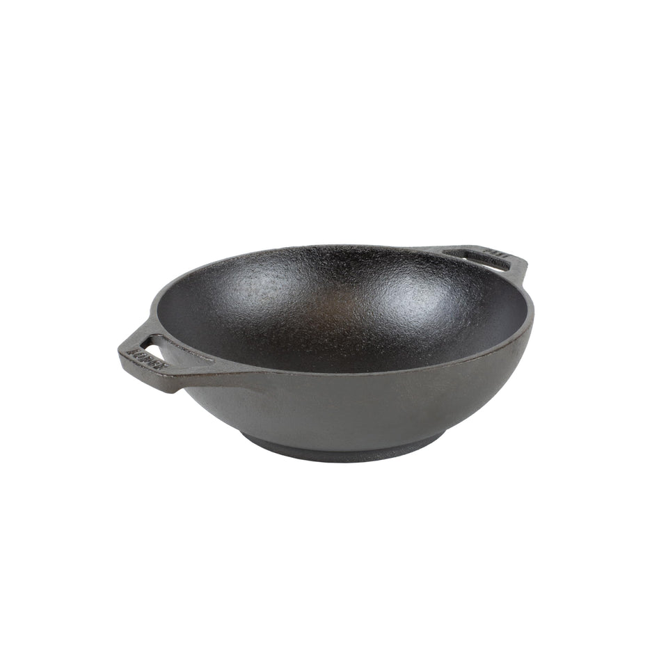 Lodge mini-wok with dual-loop handles for easy grip.