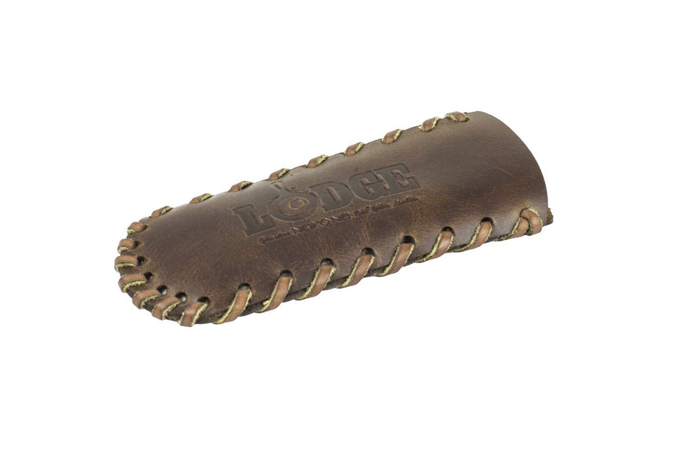 Lodge Nokona leather hot handle holder on teardrop handle, secure heat protection.
