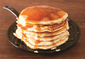 Lodge Round Seasoned Cast Iron Griddle pancakes on surface for even browning