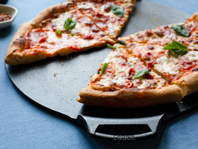 Lodge Seasoned Cast Iron Pizza Pan with dual assist handles for easy transfer