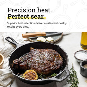 Searing steak in Lodge skillet highlighting durable heat retention.