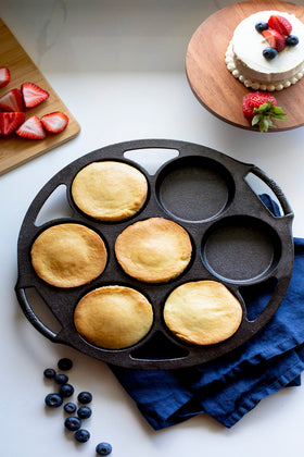 Lodge cast iron mini cake pan in use, baking diverse dishes with even browning
