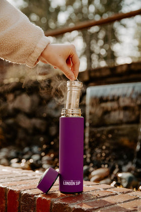 The London Sip infuser bottle used outdoors, showcasing hot or cold beverage performance.