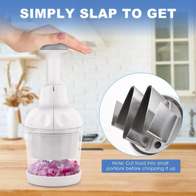 Longmann Pamperεd Chef Food Chopper beside a bowl on cutting board.