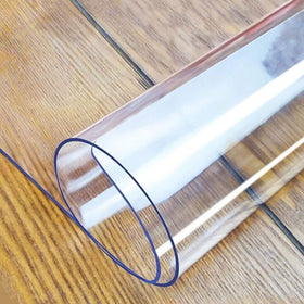 LovePads Clear Table Cover on a dining table protects from spills and stains.