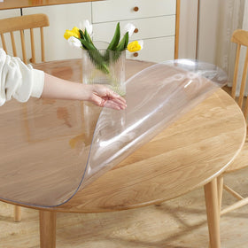 LovePads round clear table cover protector on a wooden table shields surfaces.