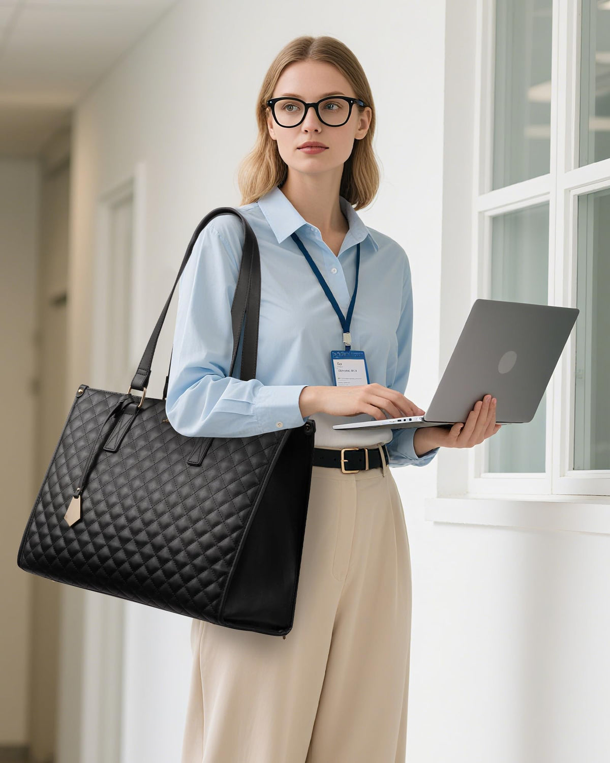 Upper laptop area fits 15.6-inch devices with charger and notebooks.
