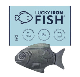 Lucky Iron Fish in pot fortifying a meal with gentle iron release.