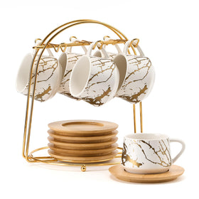 LUKA ceramic espresso cups with saucers on metal stand offer organized coffee display.