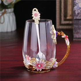 Luka Tech handmade glass mug detail – unique artisan cup with flower motif.
